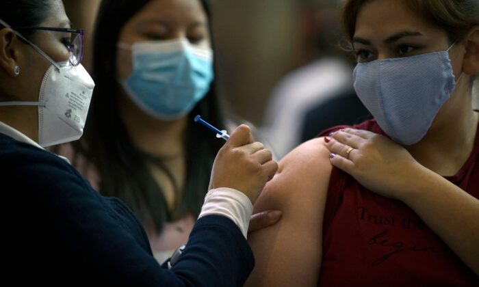 Study Reveals More than Half of COVID-19 Vaccinated Feel Sick a Year Later | The Epoch Times